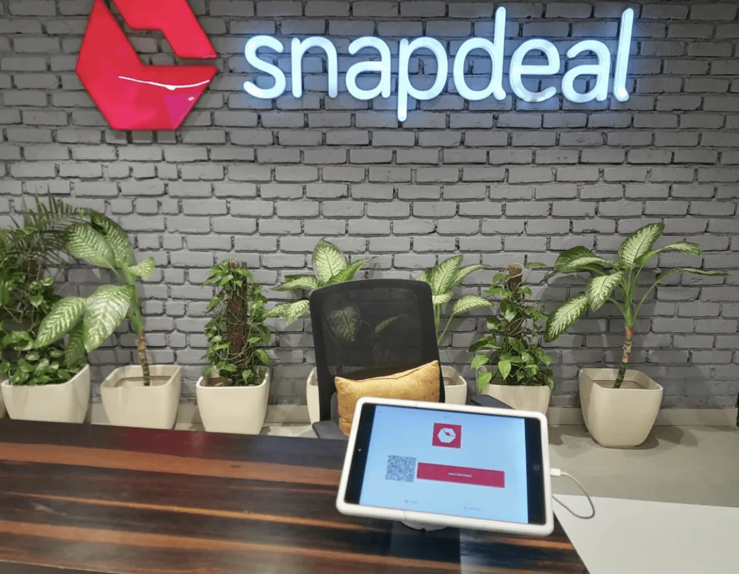 A Vizitor check in tablet on a stand at the Snapdeal reception desk